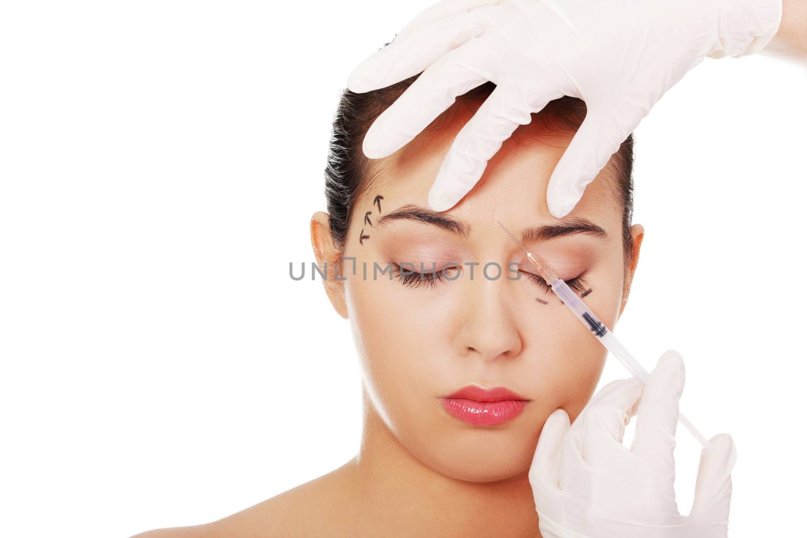 Cosmetic botox injection in the female face, eye and eyebrow zone