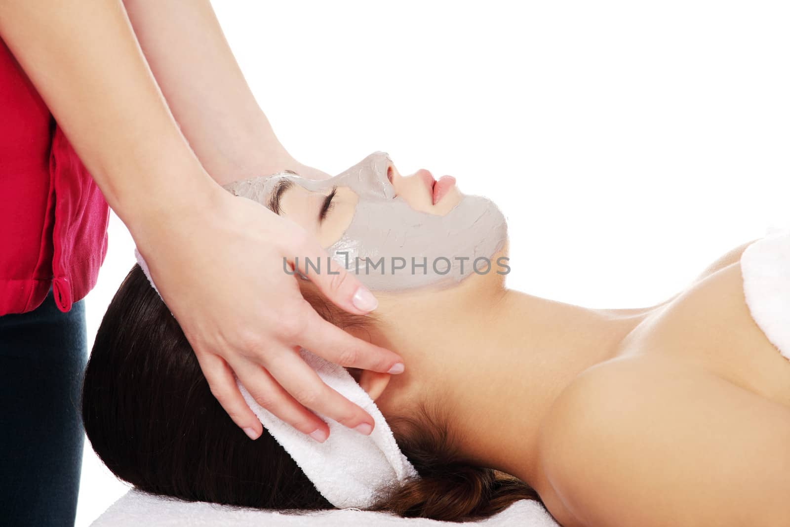 Beautiful young relaxed woman enjoy receiving head massage at spa saloon
