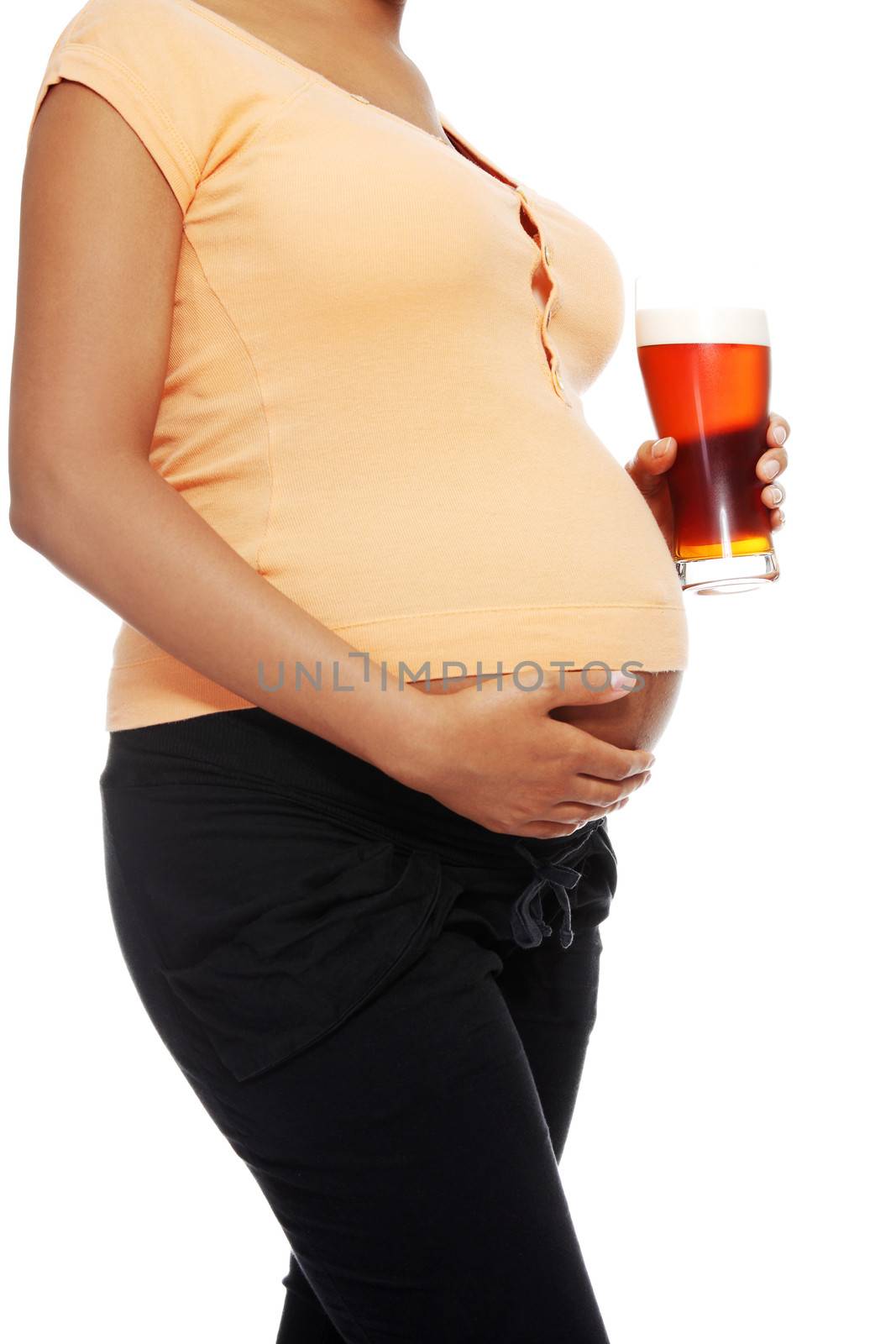 Pregnant woman holding a glass of alcohol next to her tummy by BDS