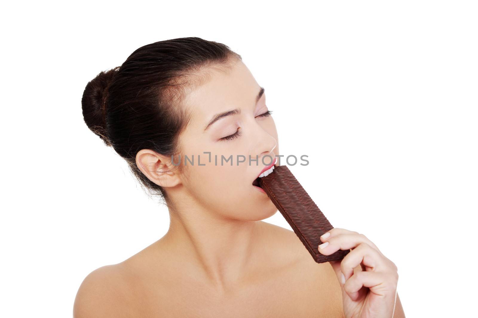 Pretty happy smiling woman eating chocolate waffle, isolated on white