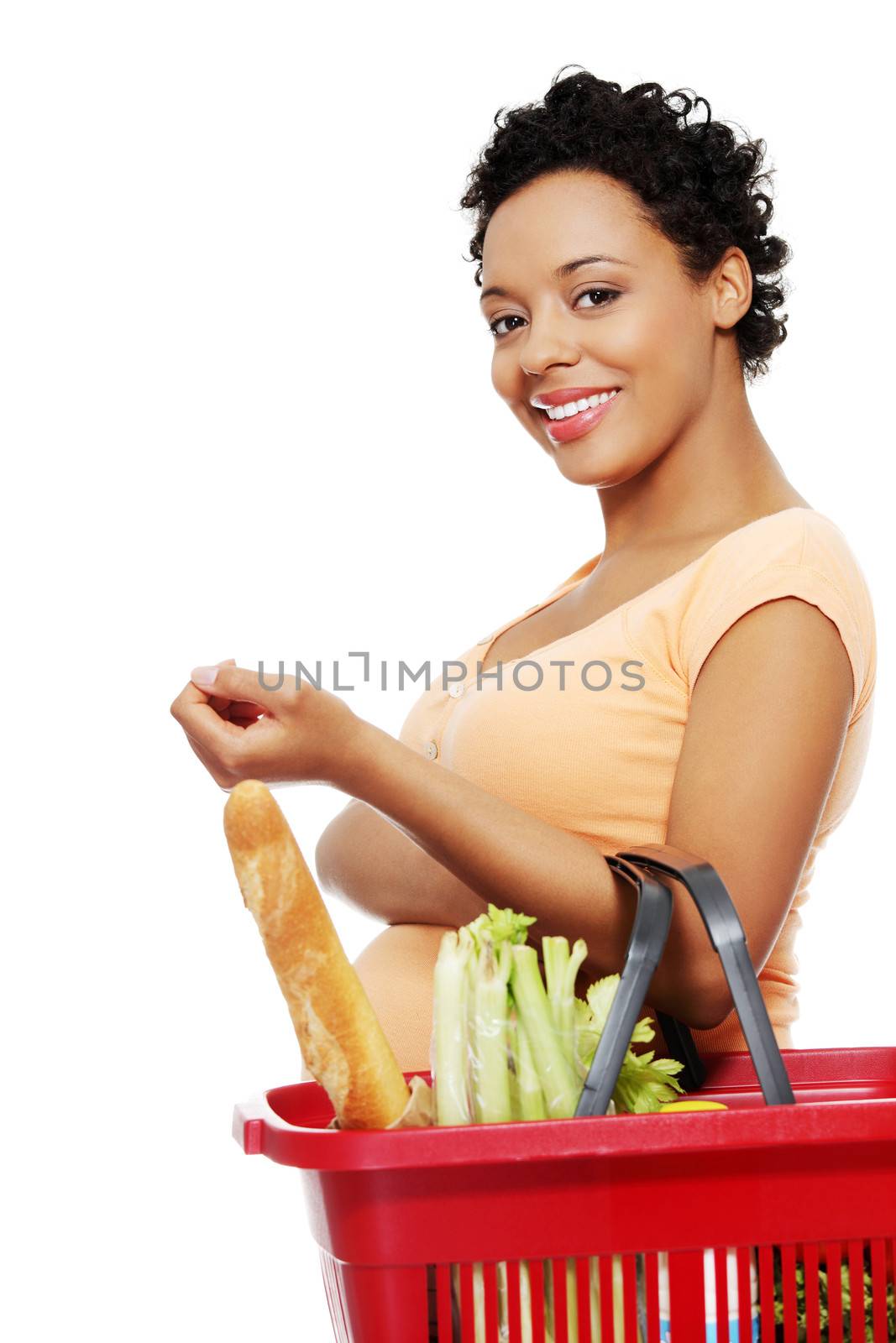 Pregnant woman with shopping basket, isolated on white