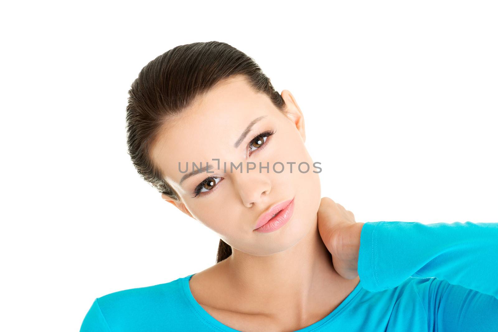 Young woman holding hand on her neck. by BDS