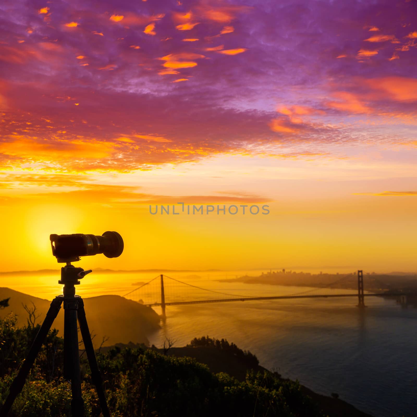 Golden Gate Bridge San Francisco sunrise California USA with photo camera silhouette