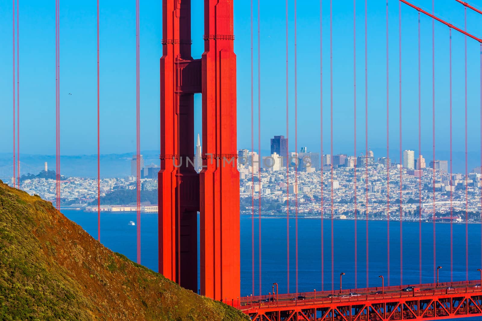 San Francisco Golden Gate Bridge through cables in California by lunamarina