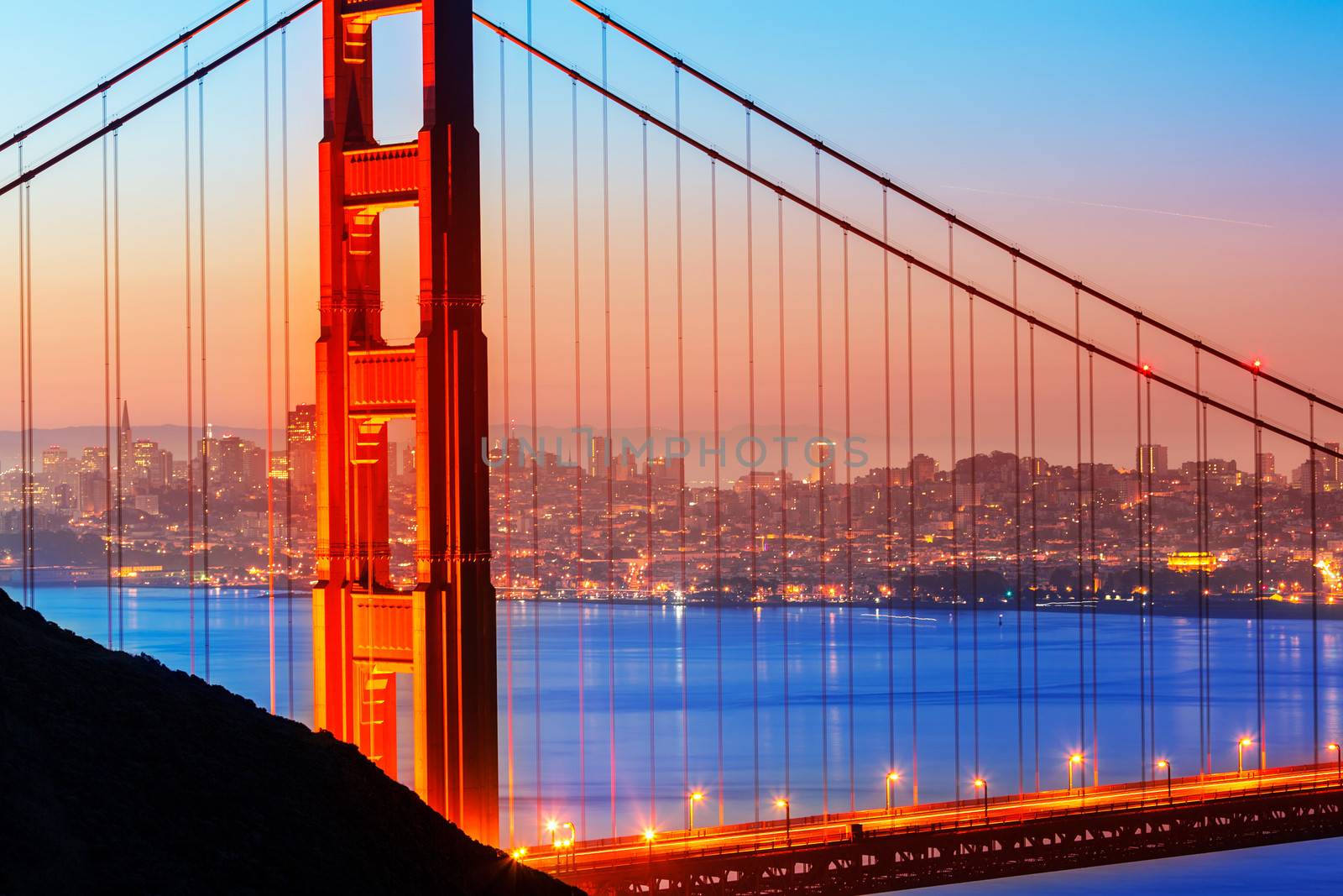 San Francisco Golden Gate Bridge sunrise view through cables in California USA