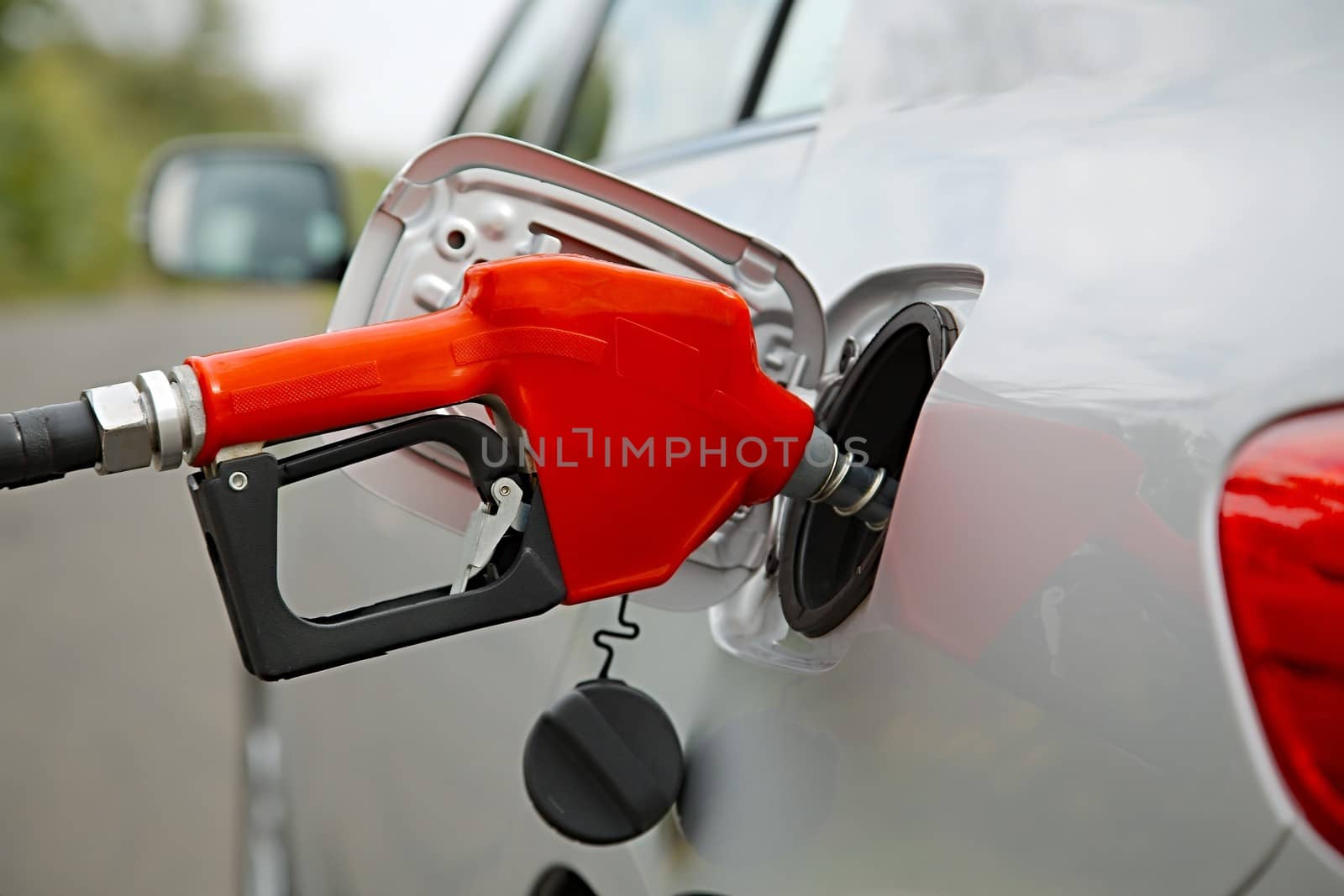 Fuel nozzle with hose isolated on white background