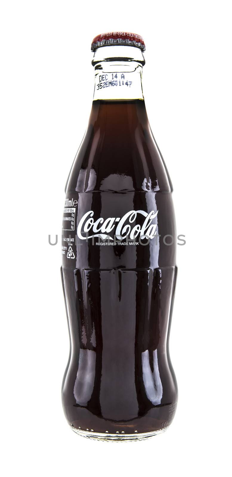 SWINDON, UK - JANUARY 1, 2014: Cassic Coca-Cola Bottle on White Background, The Coca-Cola Company  is an American multinational beverage corporation and manufacturer