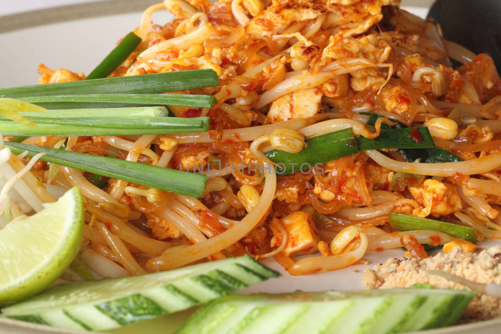 Close-up of Pad Thai fried rice noodles with shrimps and vegetables