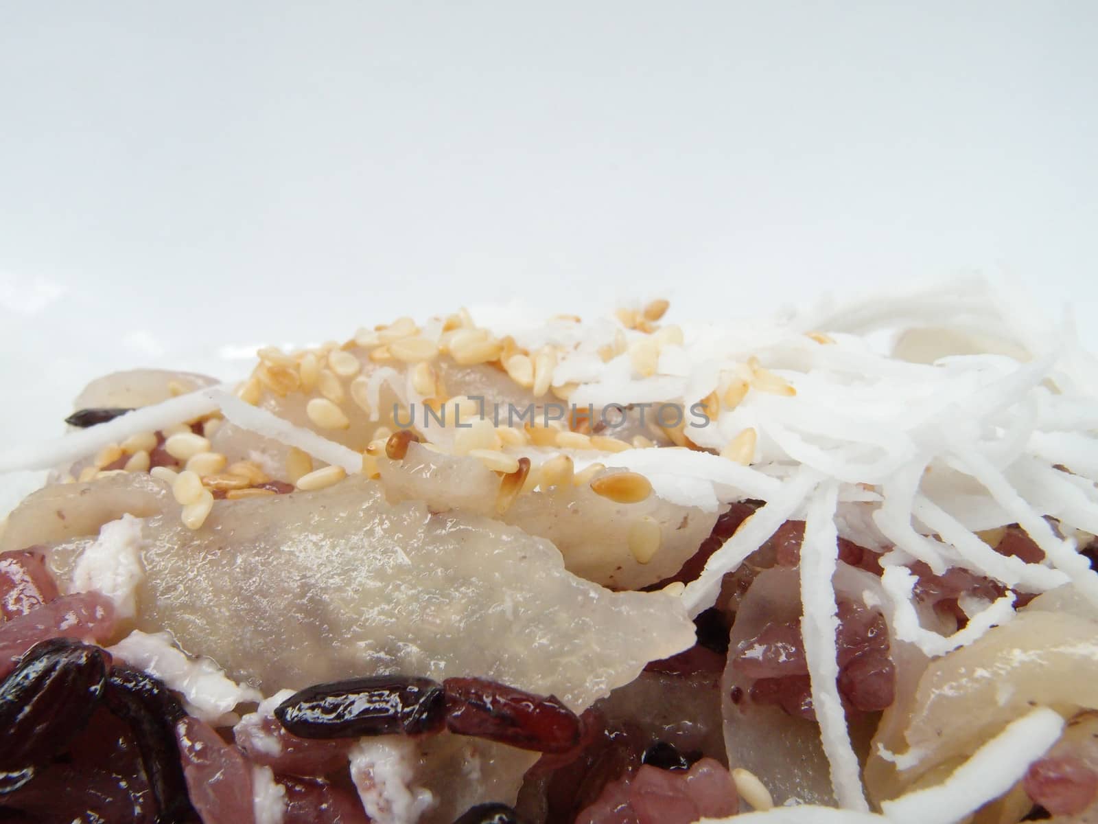 Black glutinous rice cooked in coconut milk with wild yam, Thai dessert