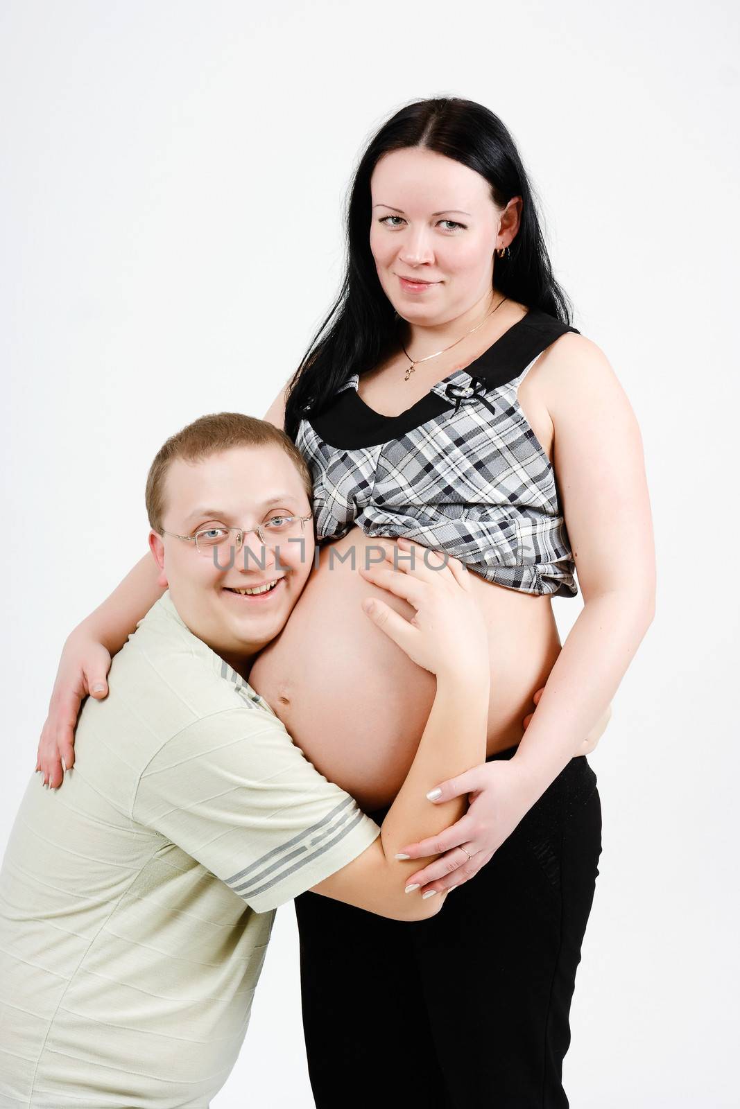 Young happy parents. Husband and pregnant wife