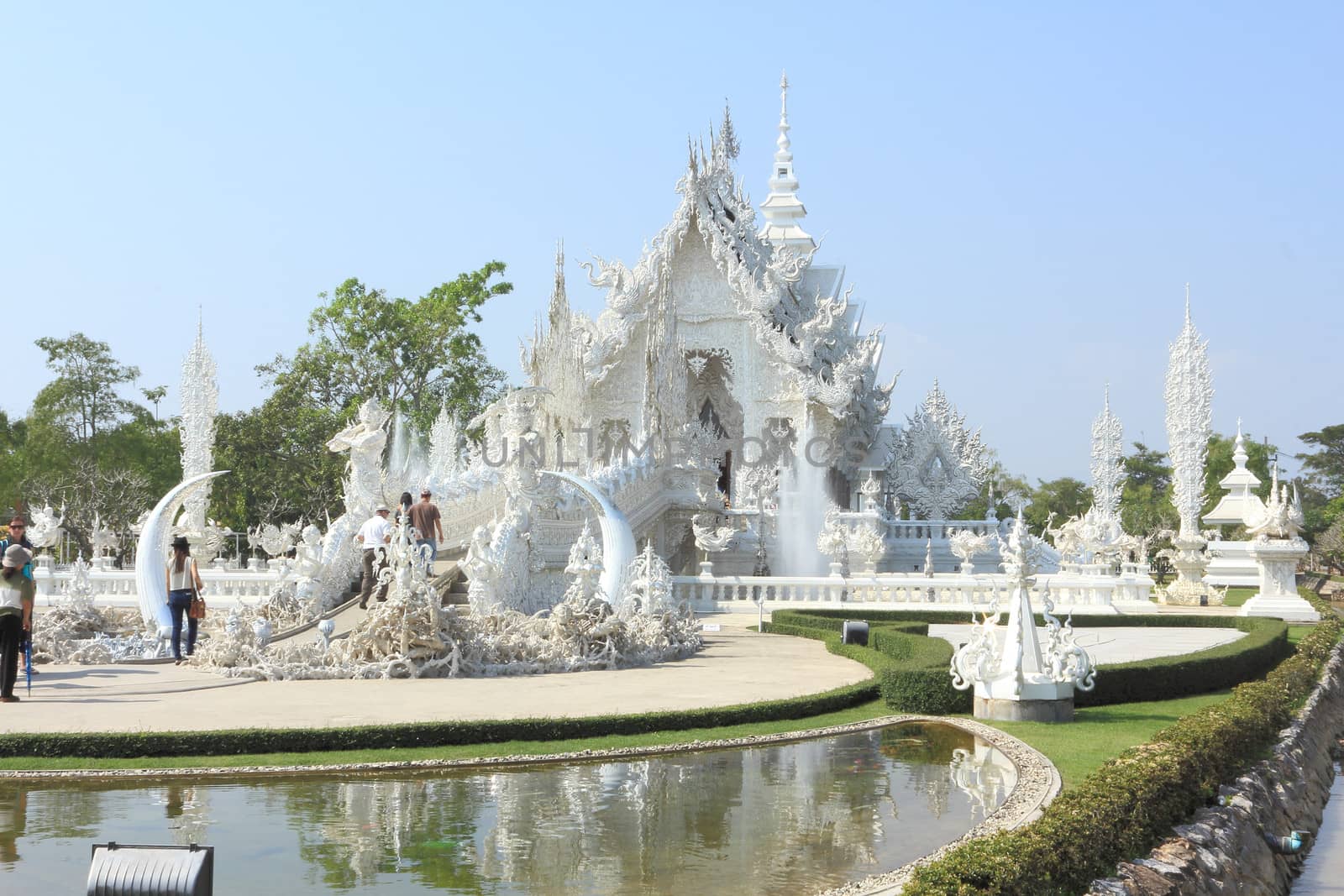 CHIANG RAI, THAILAND - JANUARY 10: Wat Rong Koon Temple on January 10, 2013 in Chiang Rai province, Northern Thailand, Wat Rong Koon Temple is a modern temple built since 1998 by Thai artist Chalermchai Kositpipat.