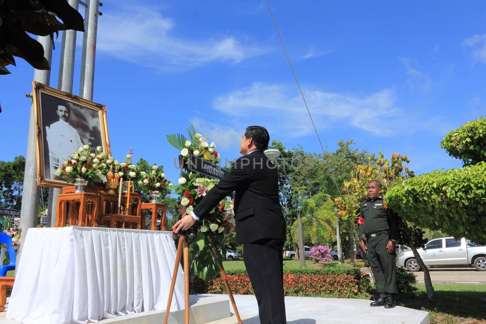 SURAT THANI, THAILAND - AUGUST 7 : Mr.Wichai Detchutipong Chief Judge of Chiya provincial court lay wreath to the picture of Rapee Pattanasak on Rapee Day Prince Rapee Pattanasak, the father of Thailand's modern legal system on August 7, 2013 in Surat Thani, Thailand.