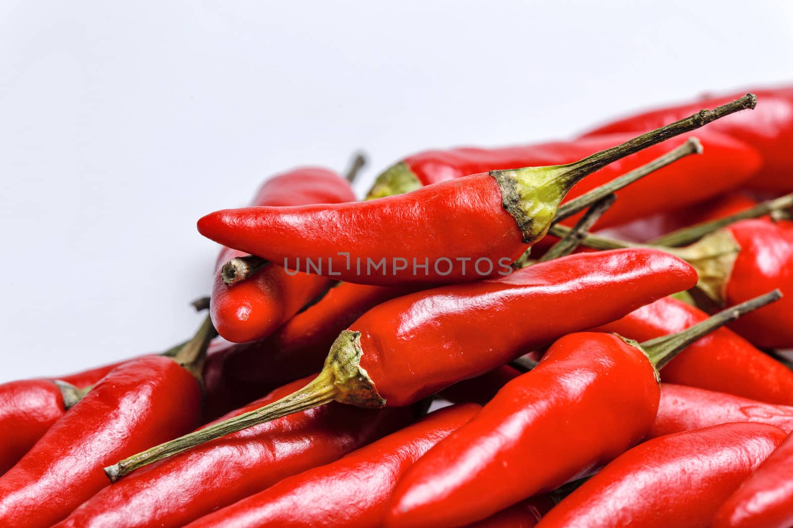 Group raw red chili peppers closeup shot