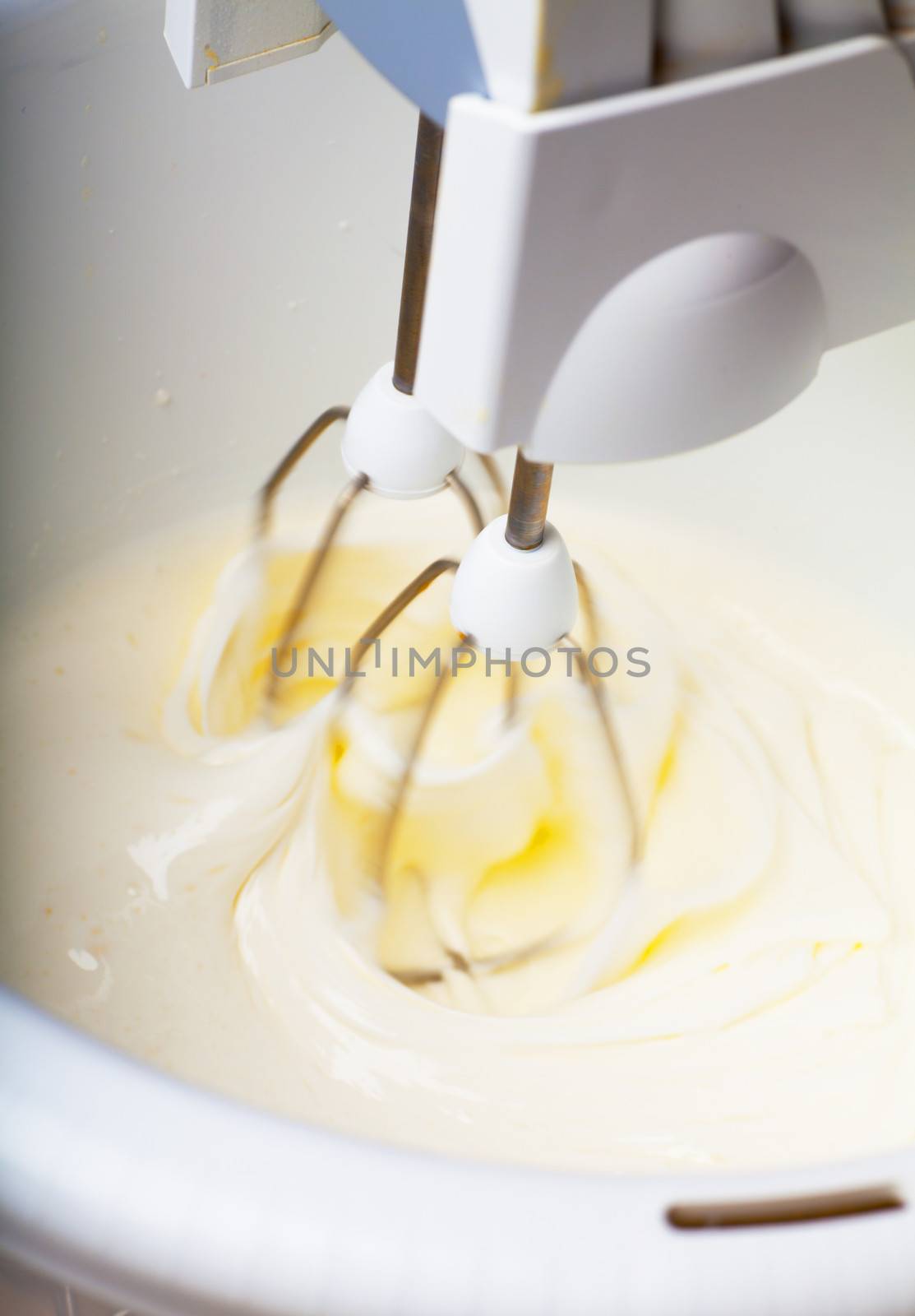 Closeup view of batter wipped with mixer