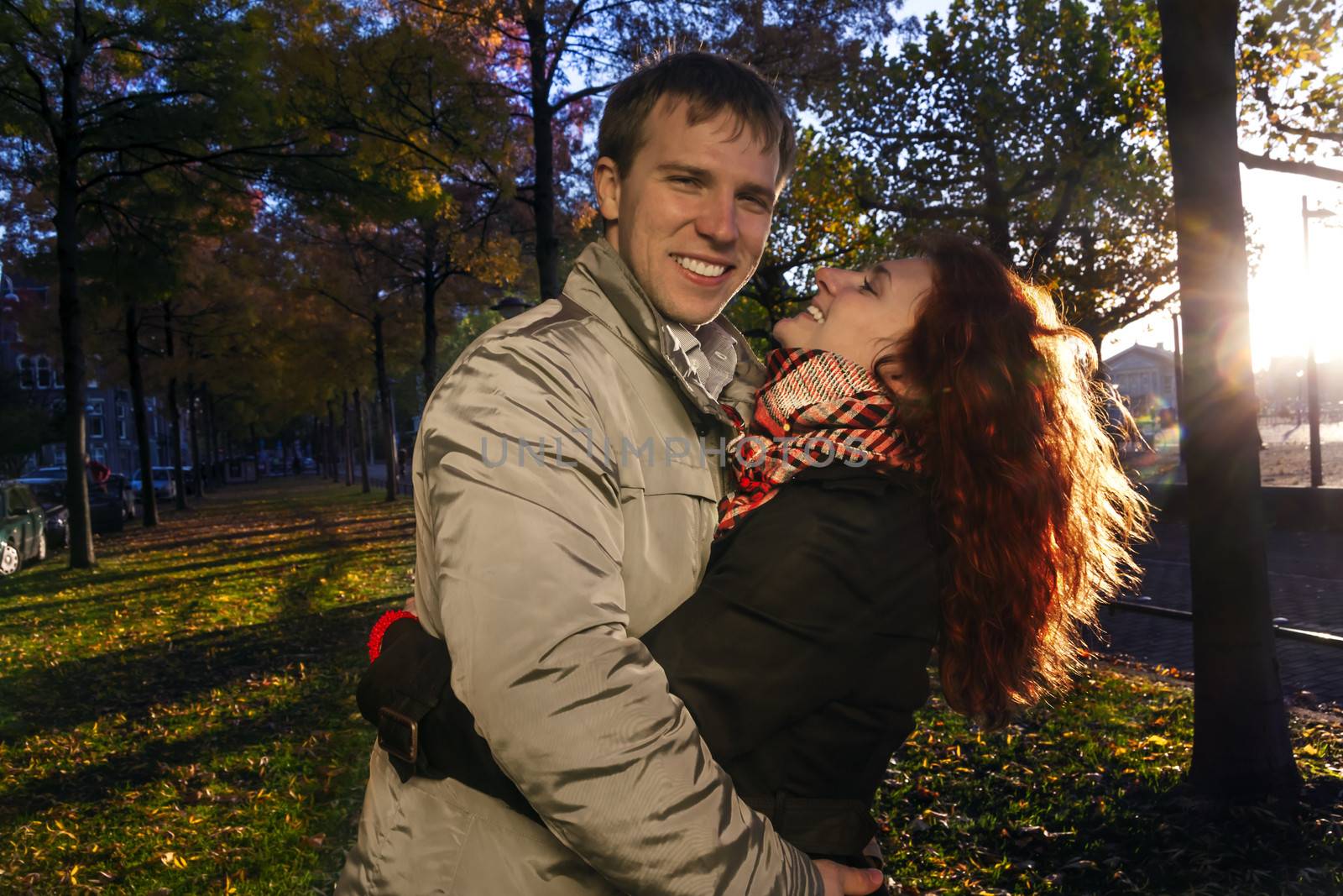 Outdoor happy couple in love, Museum Plein, autumn Amsterdam background