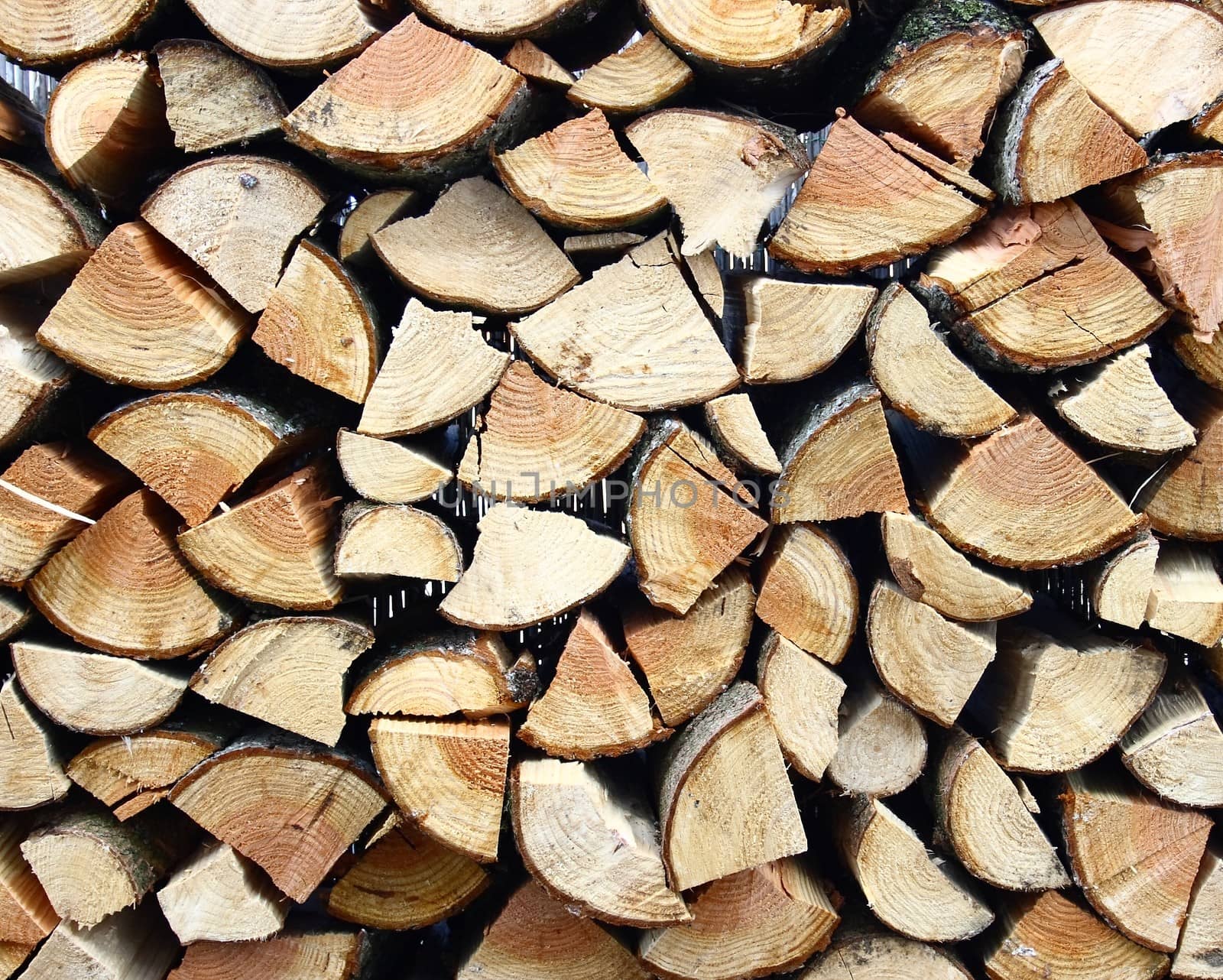 a small stack of firewood piled logs