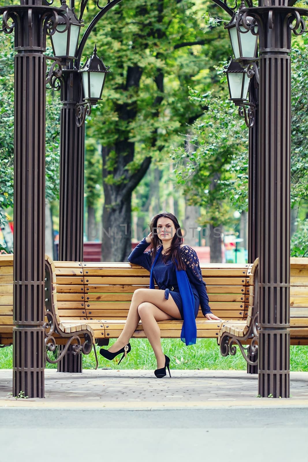 Girl sitting in the park on the bench