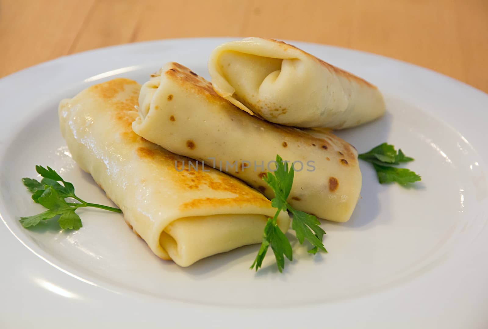 Spring rolles on the white plate by dedmorozz
