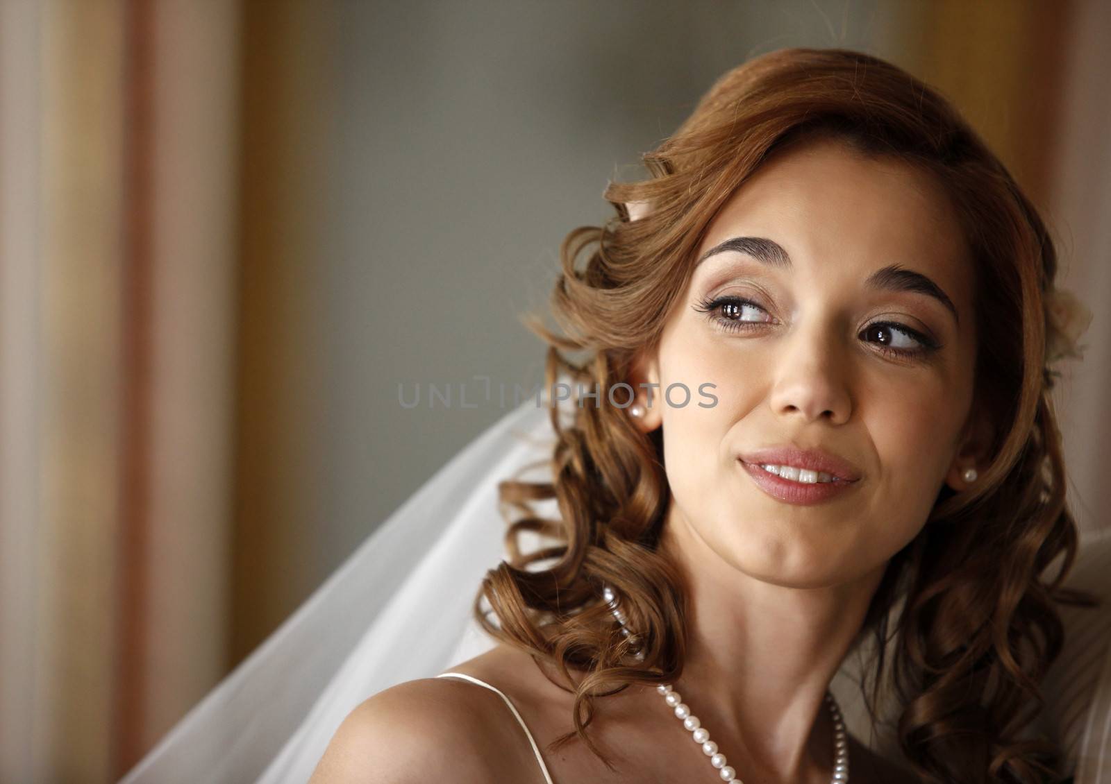 The beautiful bride on a dim background