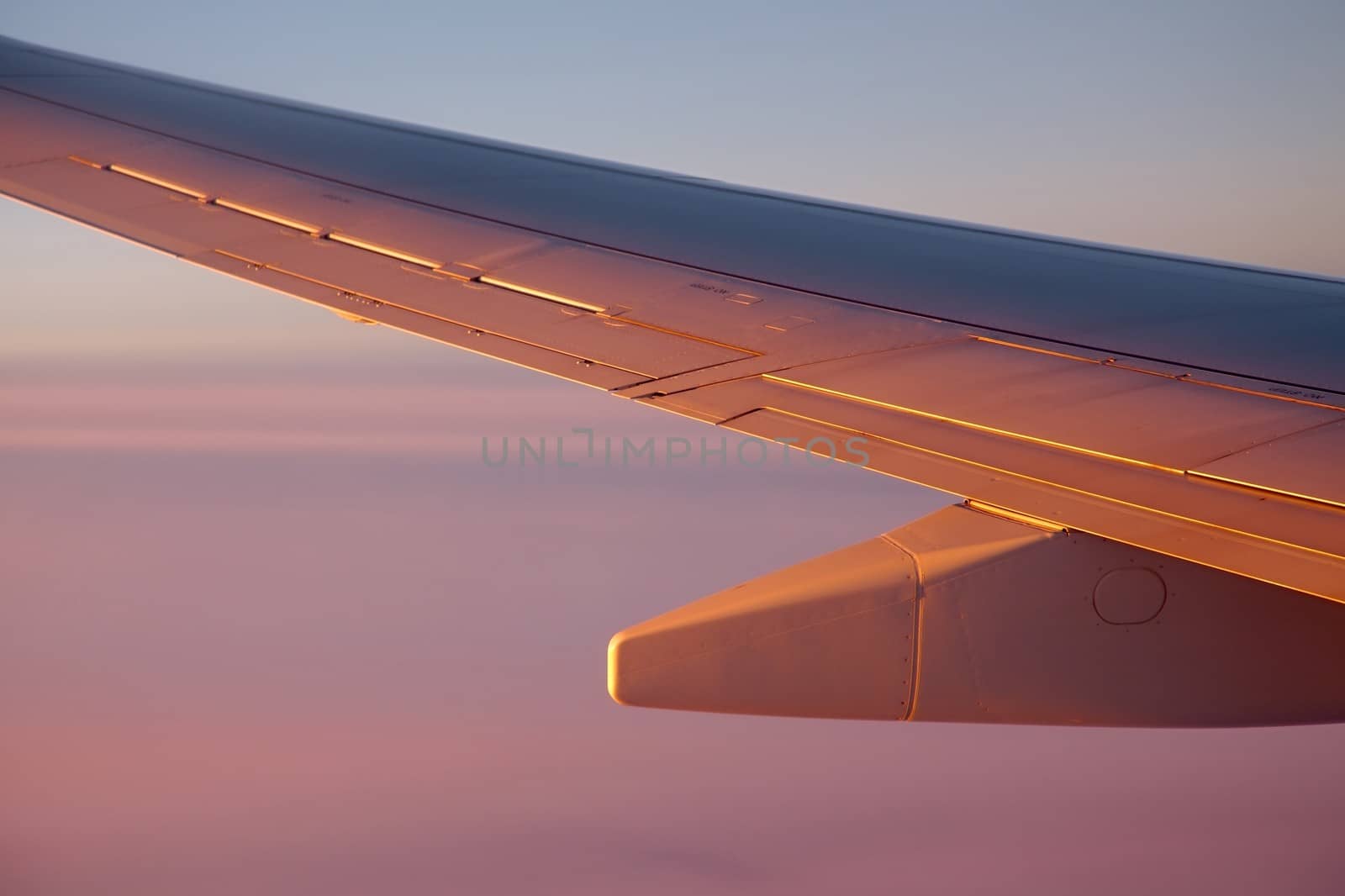 Sunrise view from an aircraft - Never forget to book a seat by the window