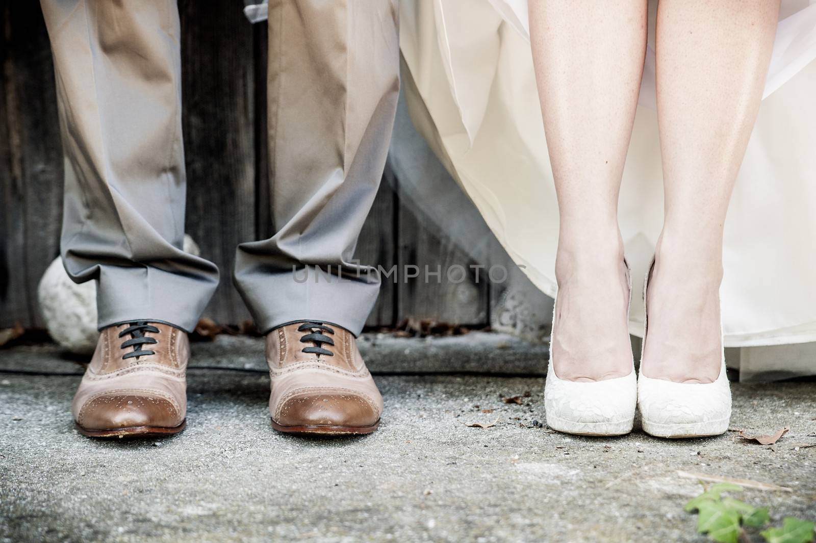 detail view of the feet of a wedding couple