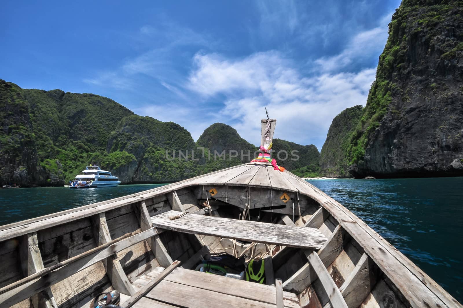 Traditional wooden boats in a picture perfect tropical Maya bay on Koh Phi Phi Island, Thailand, Asia.