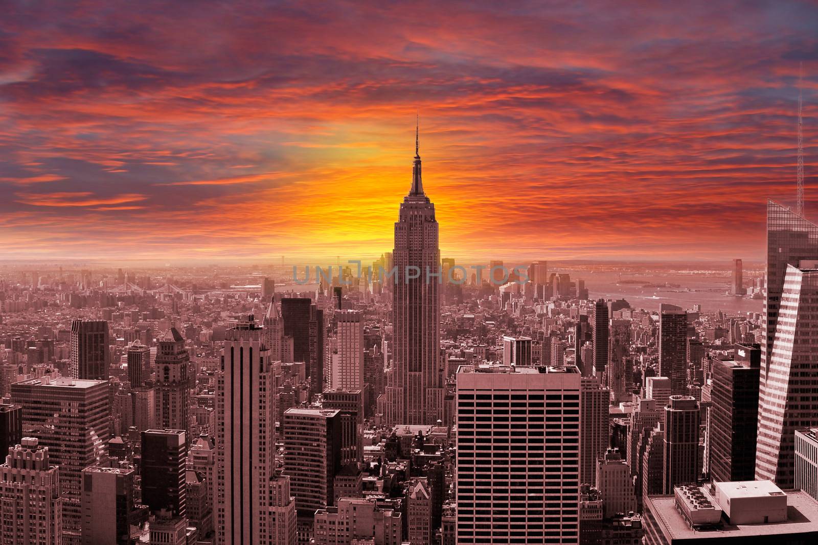 New York City Skyline with a Sunset by ruigsantos