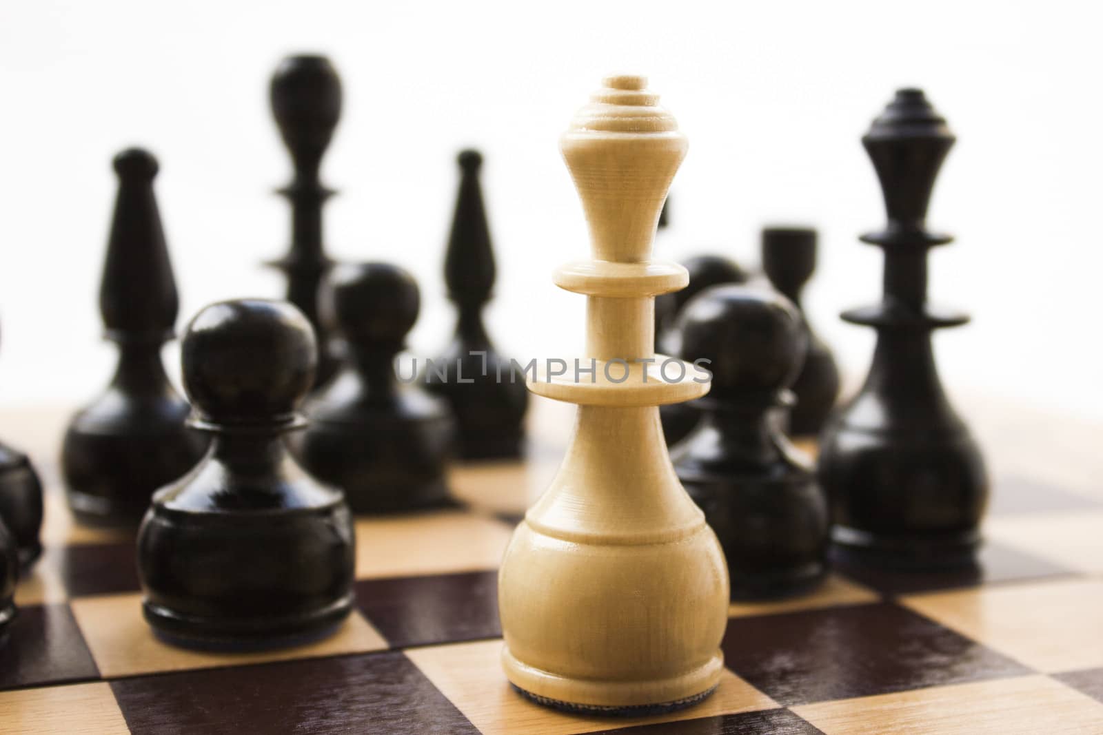 Chess pieces on a board in different compositions.