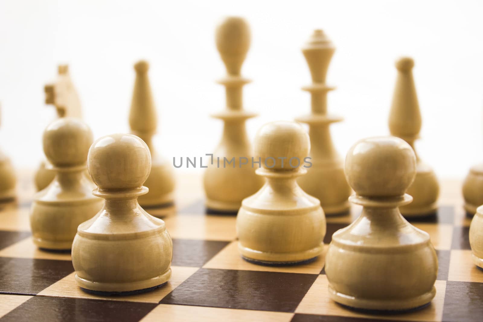 Chess pieces on a board in different compositions.