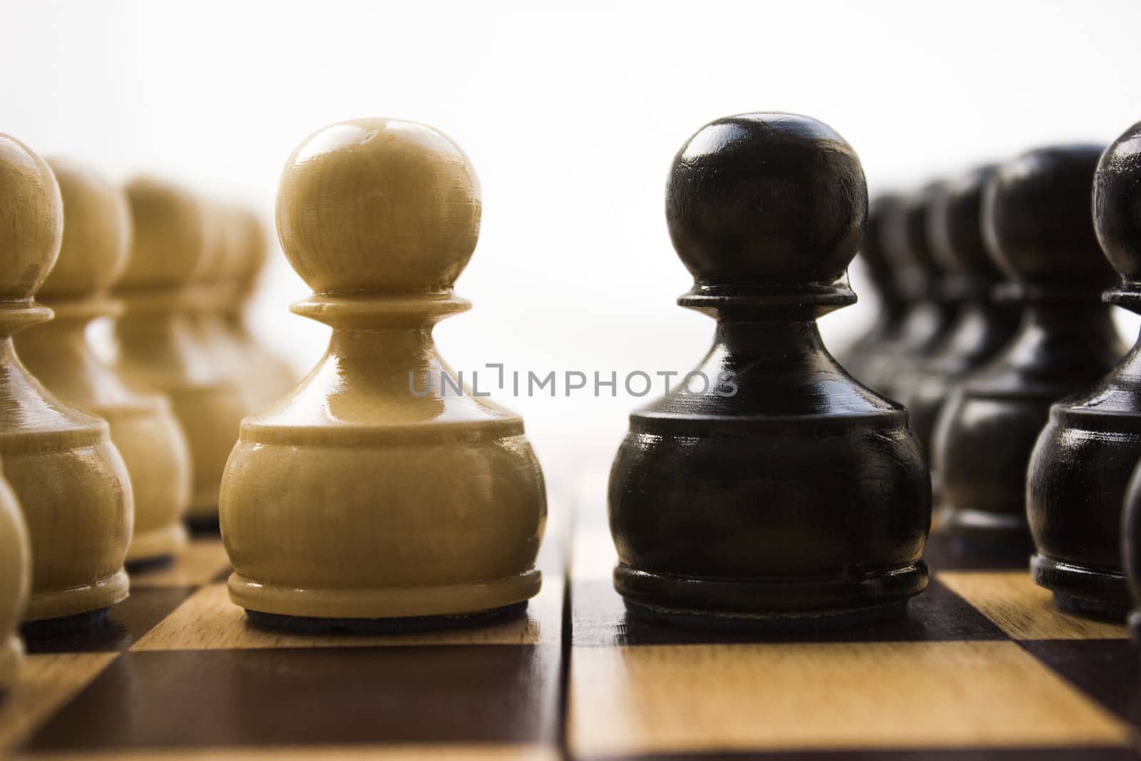 Chess pieces on a board in different compositions.