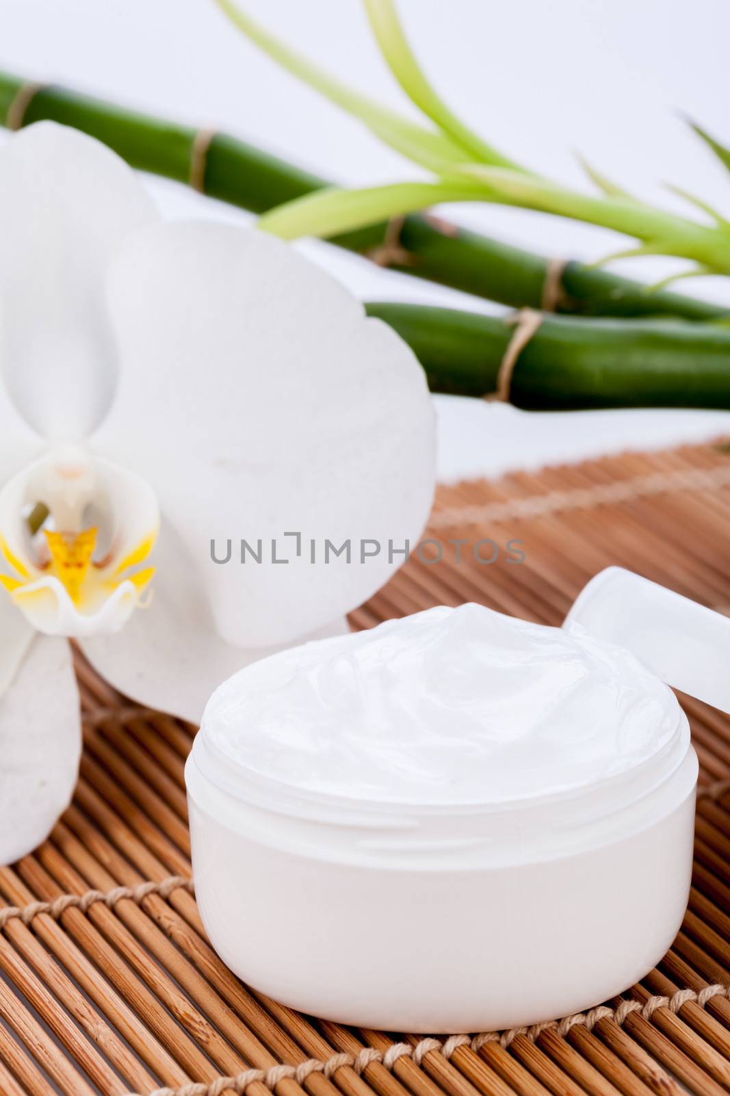 cosmetic face cream on wooden background object flower beauty