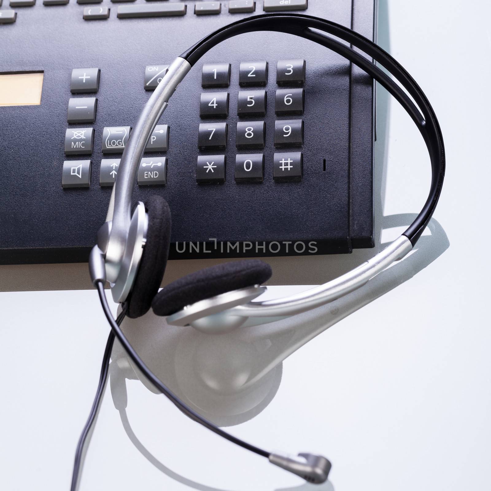 office desk with telephone and headset objects  by juniart