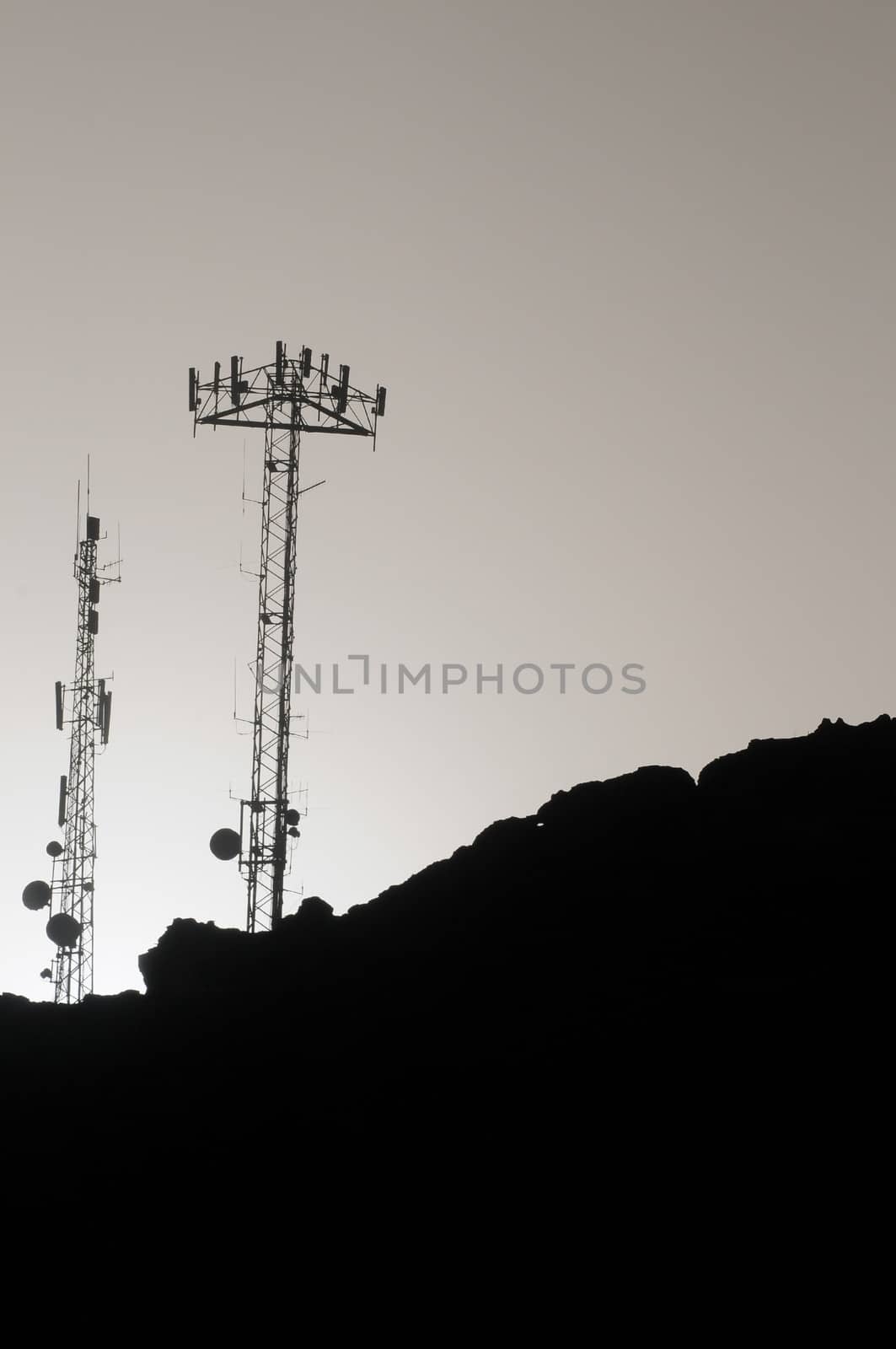 Some Silhouetted Antennas on the top of a Hill