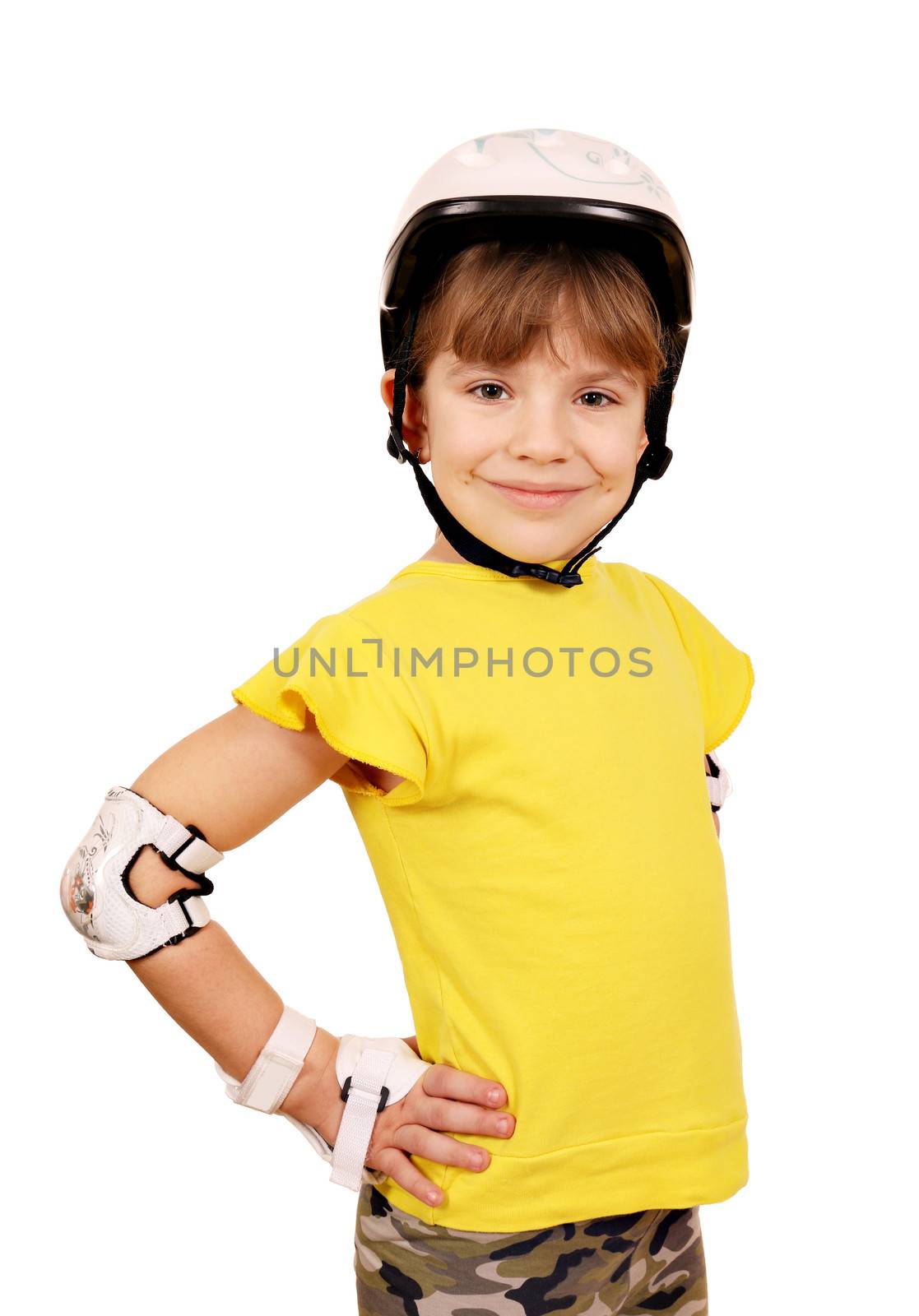 little girl with protective gear for roller skates by goce