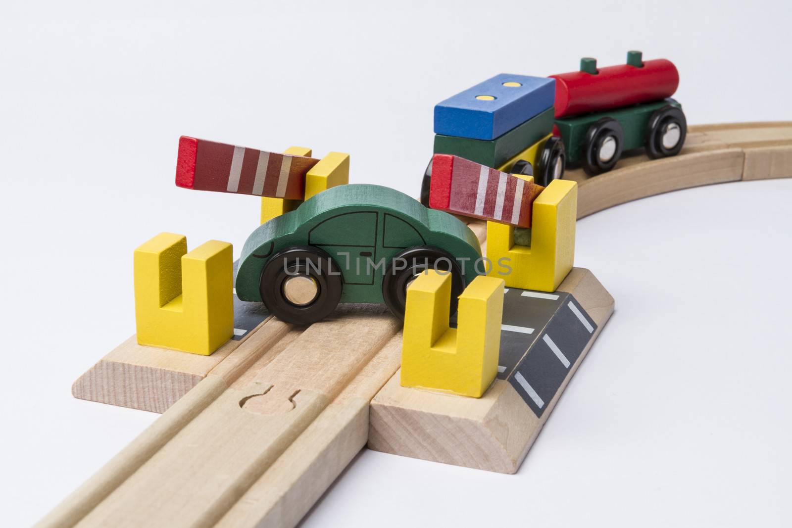 toy car on railroad crossing by gewoldi