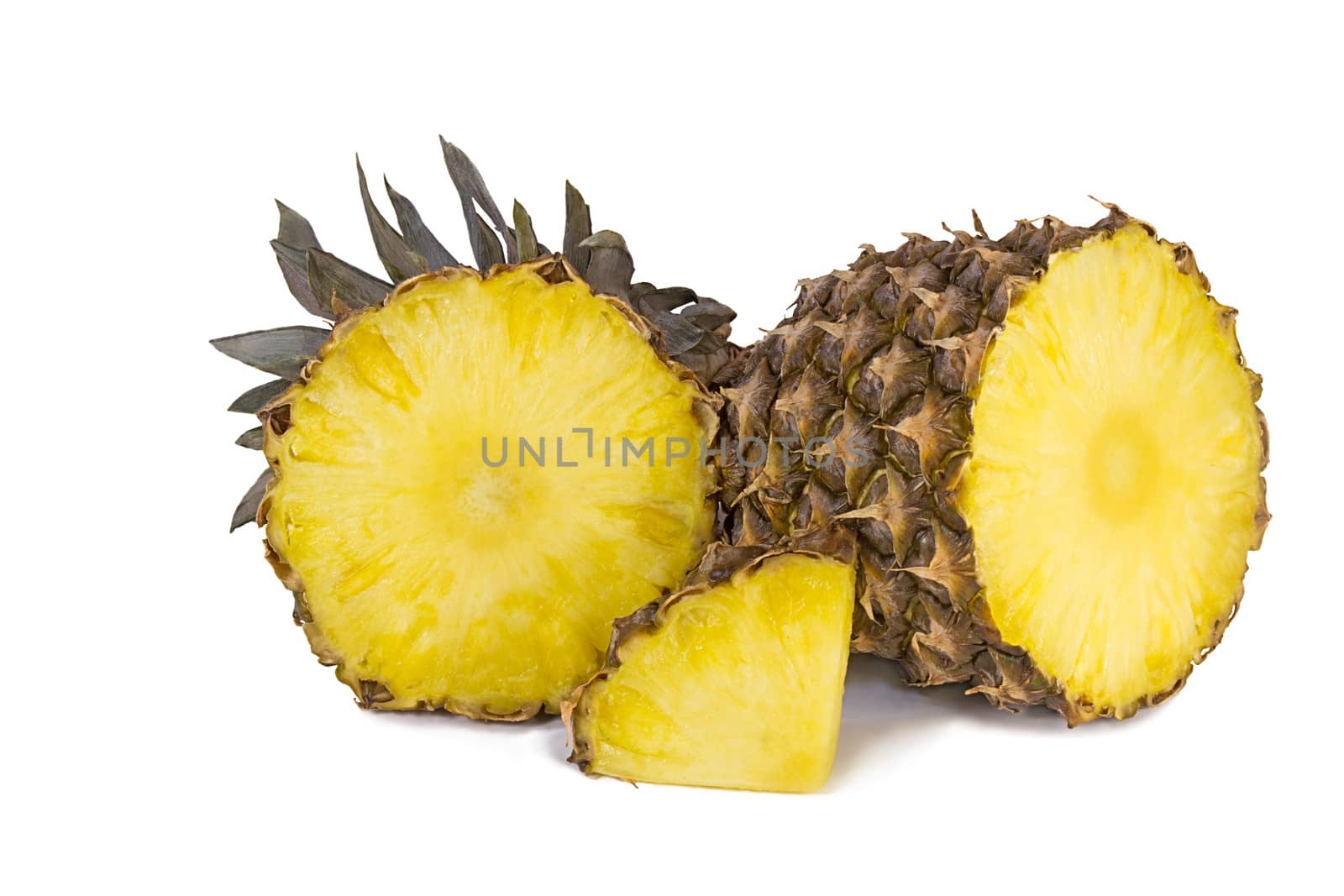 Sliced pineapple and slices of pineapple. Photographed on a white background.