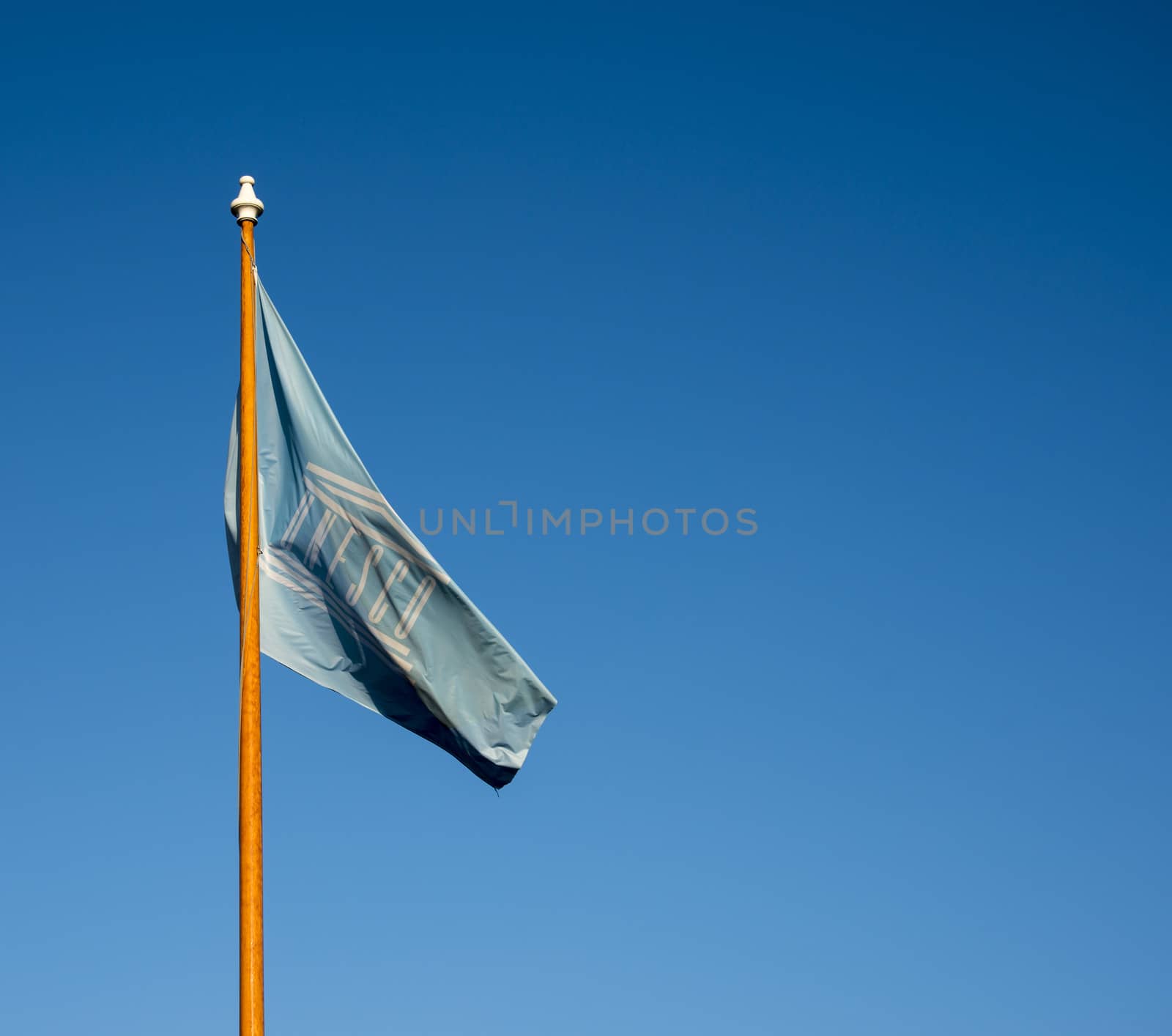 uneso flag and blue sky