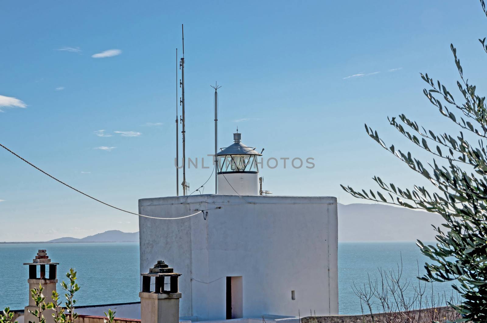 Small lighthouse placed in Talamone, in front of Tuscan Archipelago
