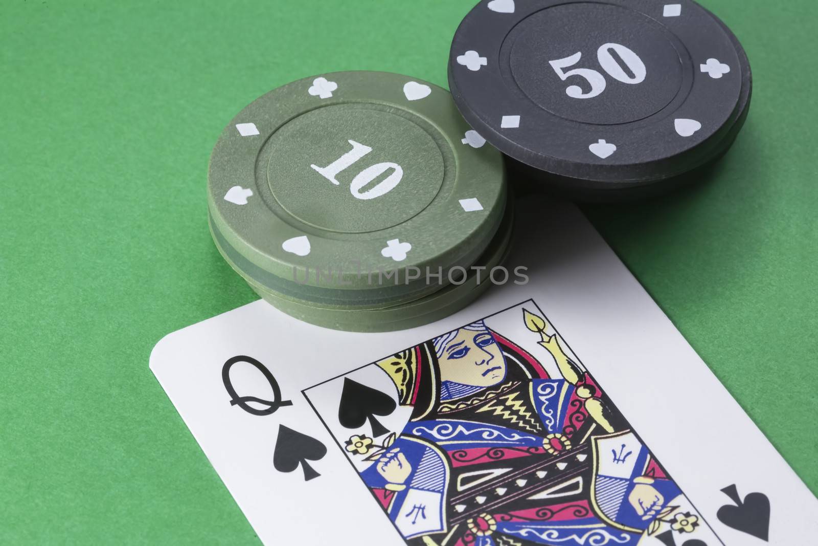 cards poker deck English, Queen of Spades, next to tabs of 10 and 50 on green background