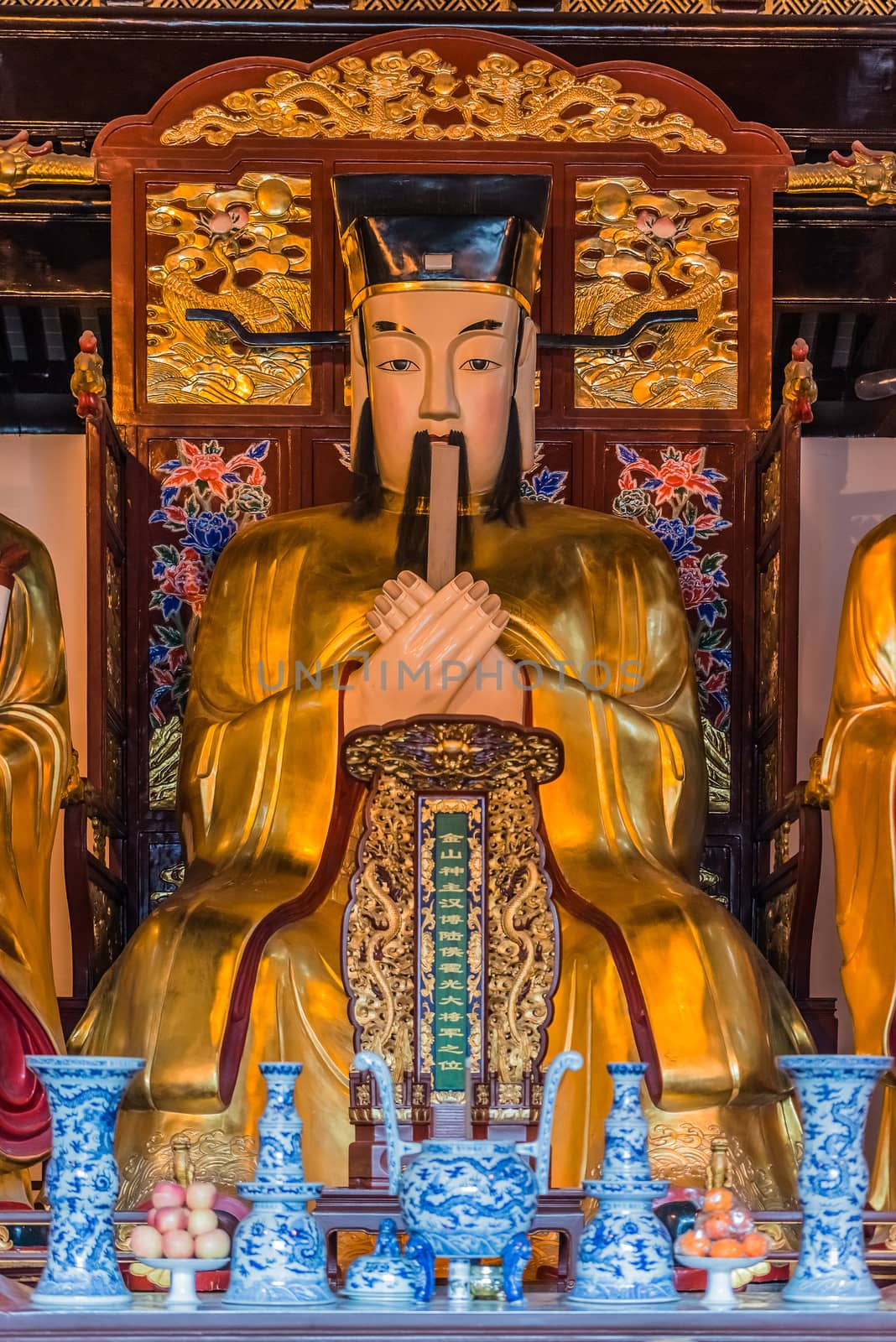 Shanghai, China - April 7, 2013: statues in the city god temple Chenghuang Miao at the city of Shanghai in China on april 7th, 2013