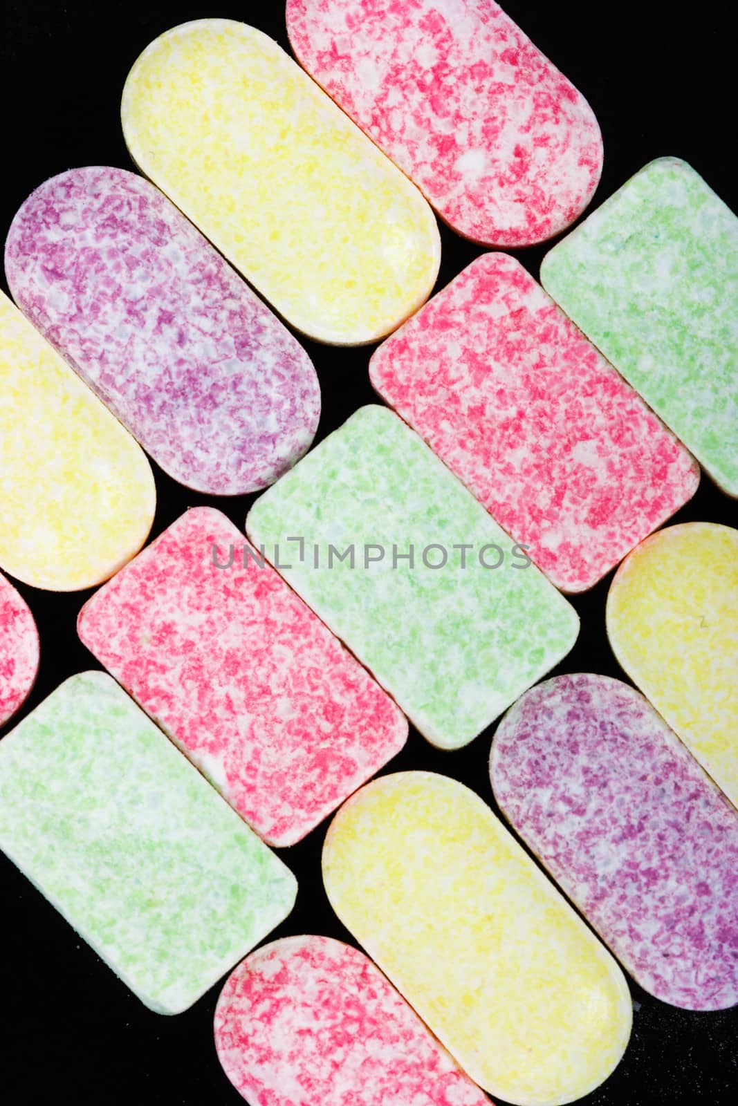 colorful rectangular candy on a black background