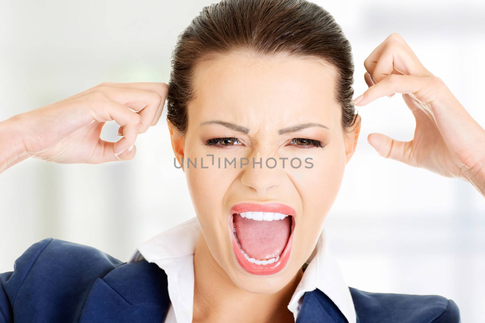 Stressed or angry businesswoman screaming loud by BDS