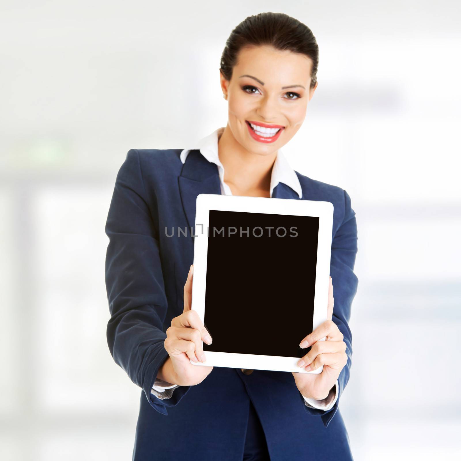 Business woman holding tablet PC with touch pad. by BDS