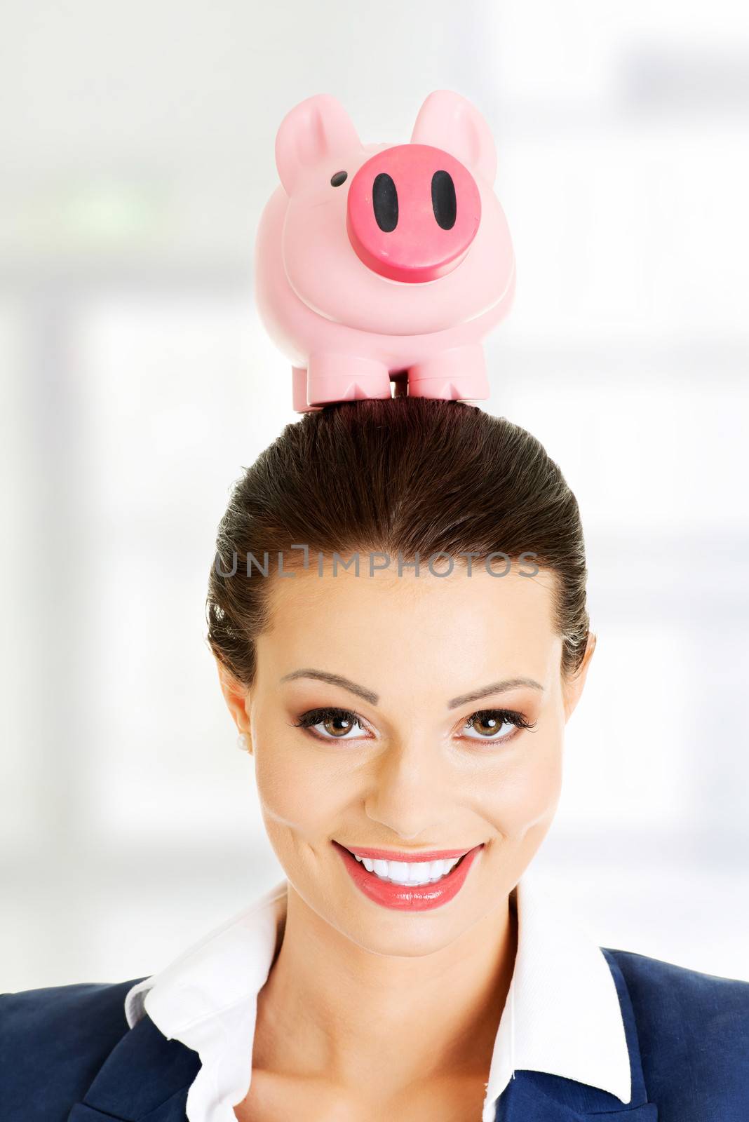 Happy business woman with her savings, isolated