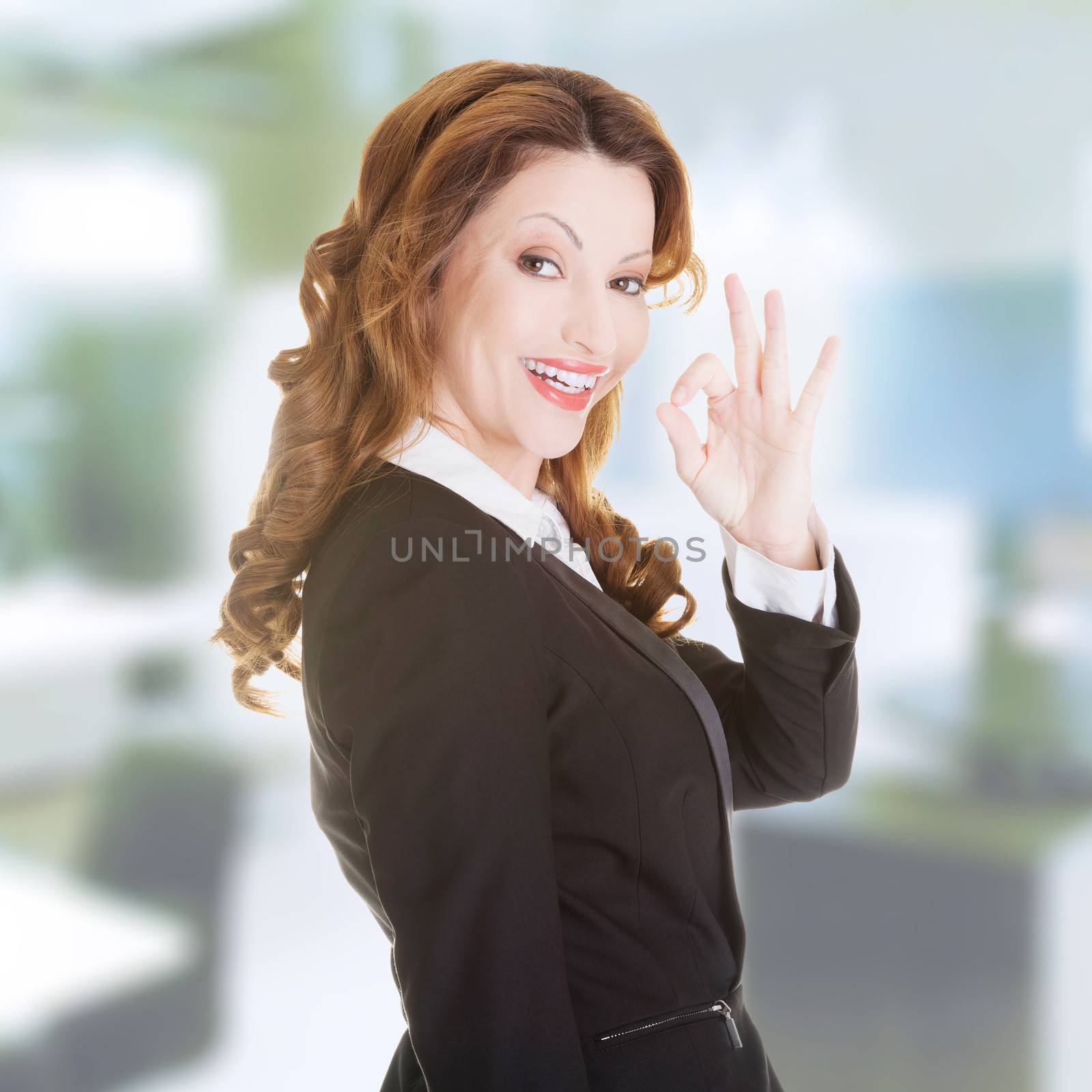 Happy smiling business woman with perfect gesture