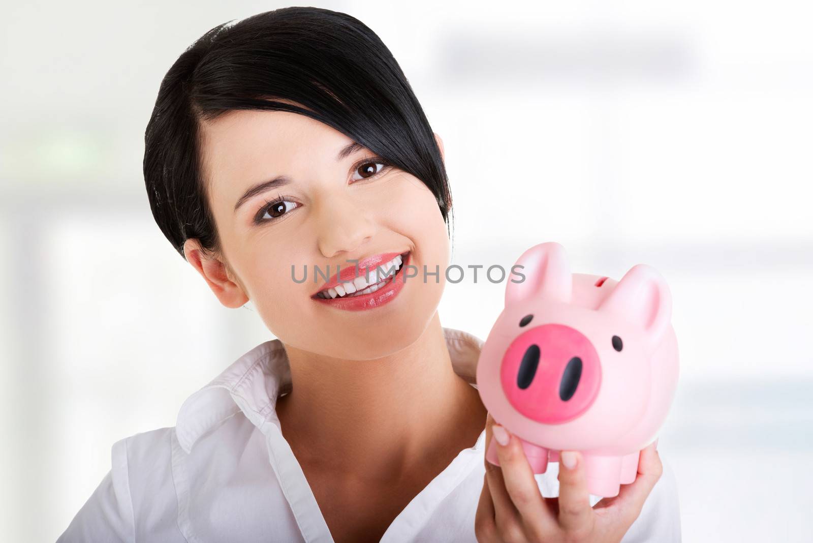 Happy business woman with her savings by BDS