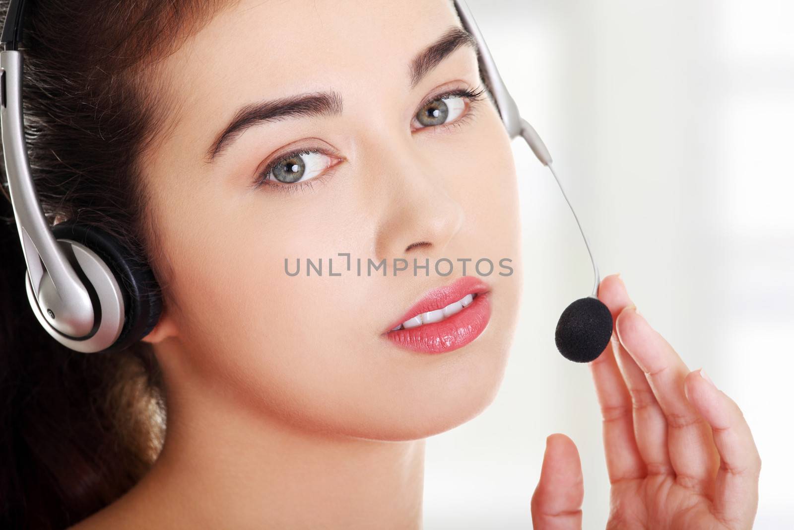 Call center woman with headset. by BDS