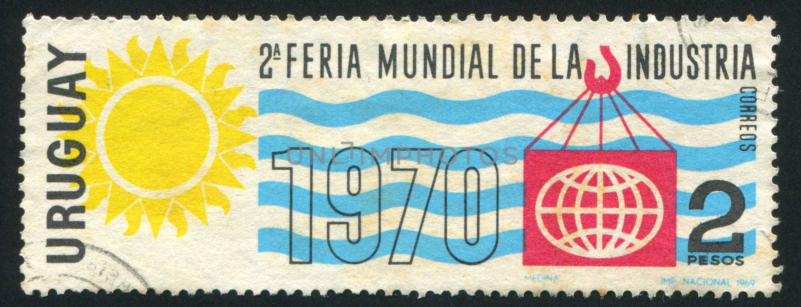 URUGUAY - CIRCA 1969: stamp printed by Uruguay, shows Industrial World Fair Emblem, circa 1969