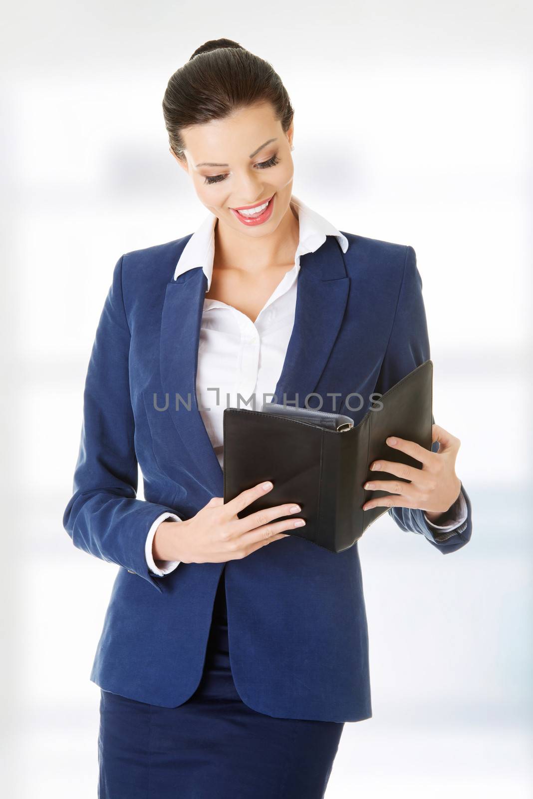 Attractive happy businesswoman by BDS