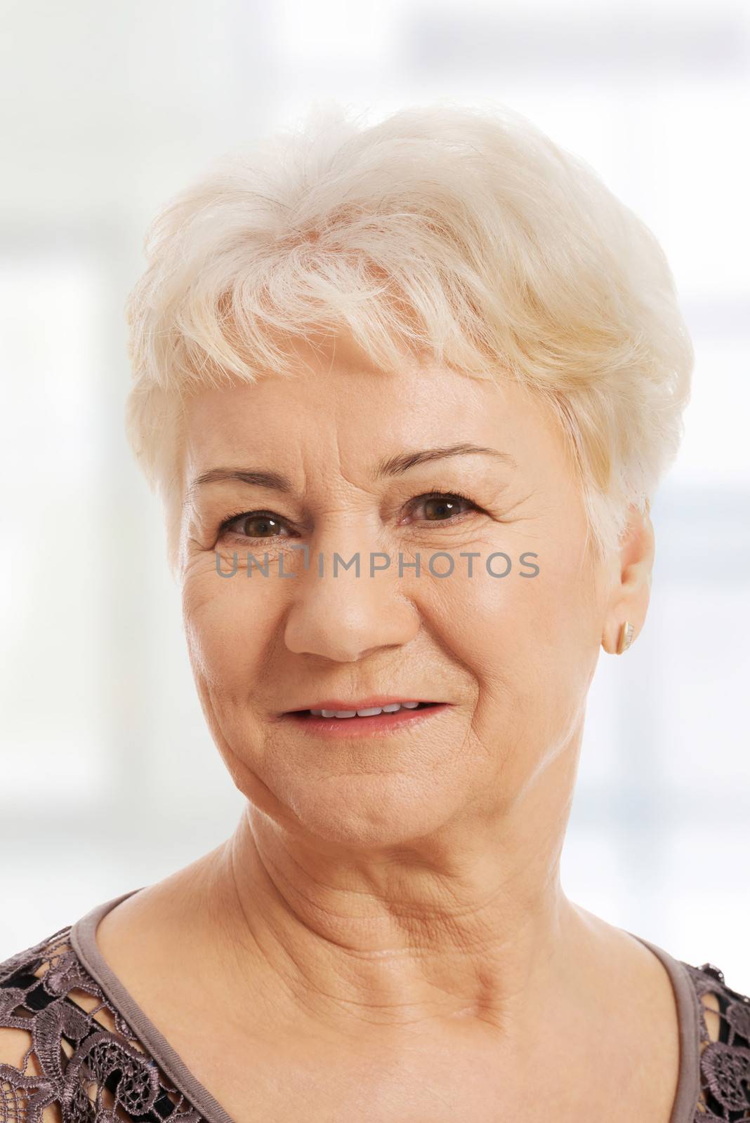 Portrait of an old, elderly lady. isolated on white.